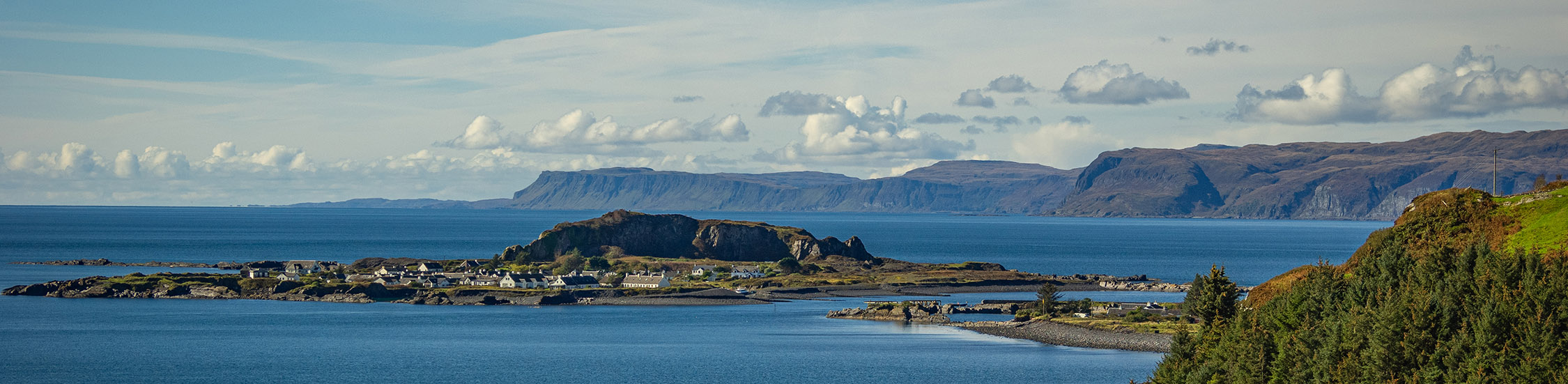 A picturesque image of Easdale with the Isle of Mull in the background.